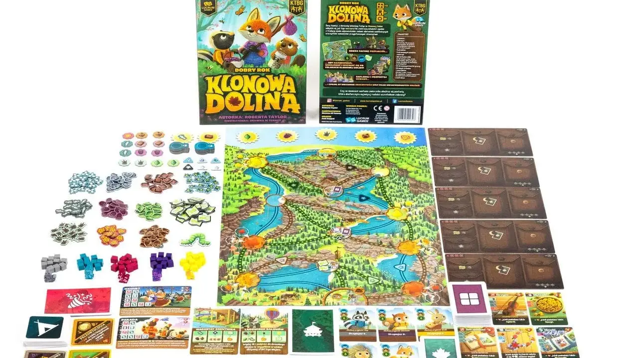Gra planszowa "Klonowa Dolina" z planszą, kartami i żetonami. Zwierzątka wyruszają na przygodę w malowniczej dolinie.