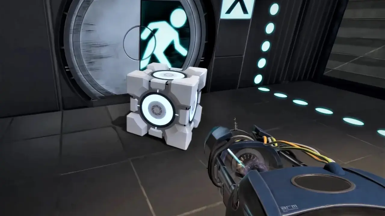 Kostka towarzysząca i portal gun w grze komputerowej Portal.