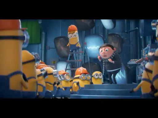 Gru przemawia do grupy minionków, które pracują w laboratorium. Widać różne minionki części, niektóre w kaskach.
