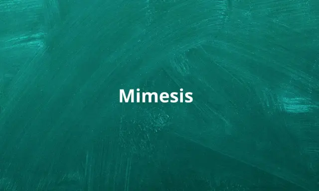 Biały napis "Mimesis" na zielonej tablicy. To pojęcie kluczowe dla zrozumienia, jak literatura naśladuje rzeczywistość.