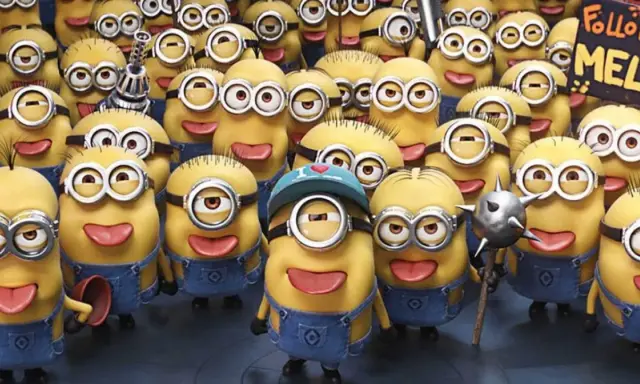 Grupa wesołych, żółtych minionków postacie w niebieskich ogrodniczkach, jeden z nich trzyma tabliczkę "Follow MEL".