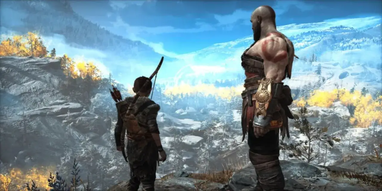 Kratos i Atreus patrzą na zimowy krajobraz. Czas gry w God of War to epicka podr&oacute;ż.
